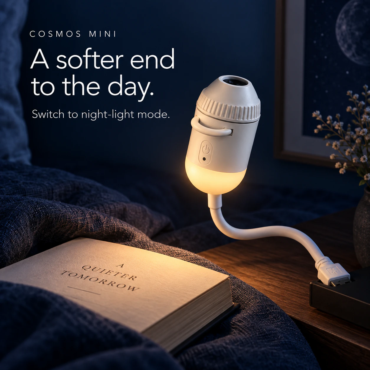 COSMOS Mini with its lower night-light diffuser glowing beside a book